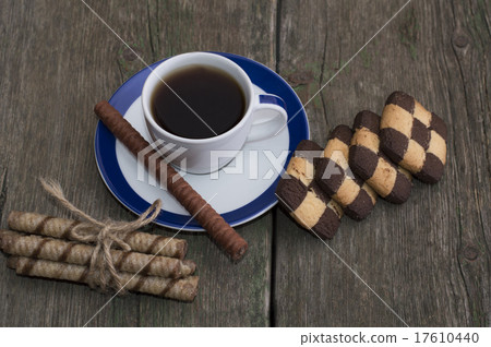 coffee and two rows  on the shabby desktop 17610440