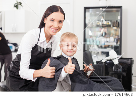 Beautiful young female barber is working in salon Beautiful young female barber is working in salon 17614668