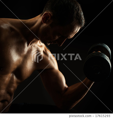 silhouette of young muscular fitness man on black 17615293
