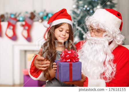 Pretty girl sitting with Santa  17618155