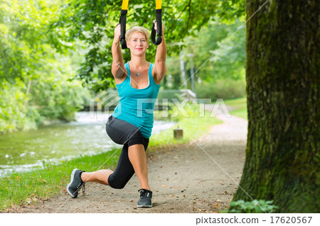 woman doing suspension sling trainer sport 17620567