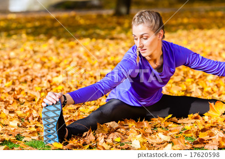 Woman doing gymnastics in autumn foliage 17620598