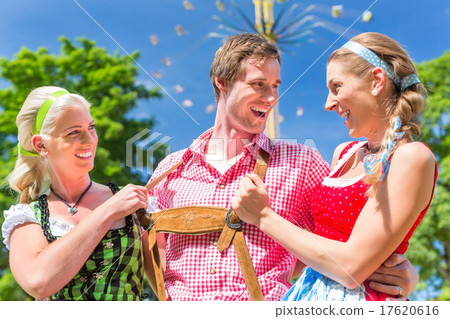 Friends visiting Bavarian folk festival 17620616