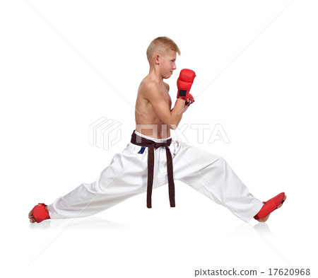 Karate boy sits on a twine Karate boy sits on a twine 17620968
