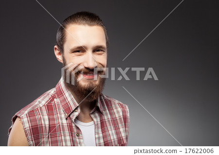 Cheerful young bearded guy is expressing positive 17622006