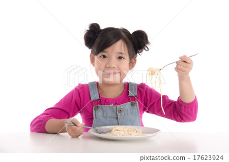 Cute asian girl eating Spaghetti Carbonara Cute asian girl eating Spaghetti Carbonara 17623924