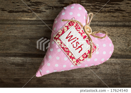 Pink handmade fabric heart with word WISH  17624540