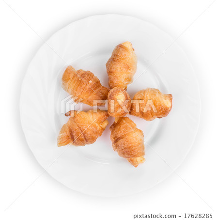 Fresh croissants on white plate. 17628285