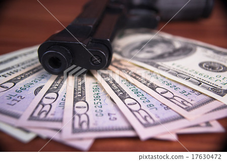 Gun, drugs and money on wooden background Gun, drugs and money on wooden background 17630472