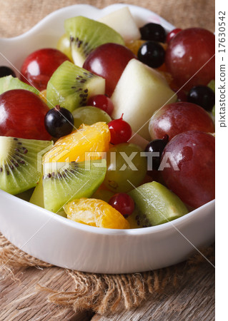 salad of oranges, kiwi, grapes macro. vertical salad of oranges, kiwi, grapes macro. vertical 17630542
