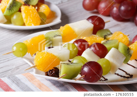 Fresh fruit on skewers close-up. Horizontal Fresh fruit on skewers close-up. Horizontal 17630555