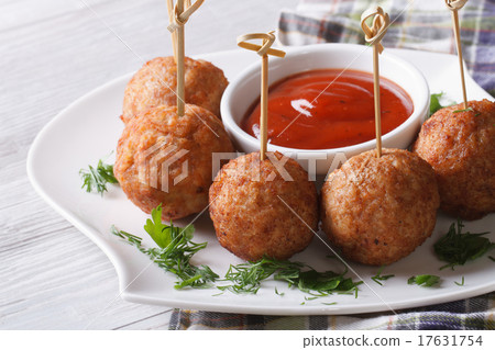 meatballs on skewers and ketchup on a plate 17631754