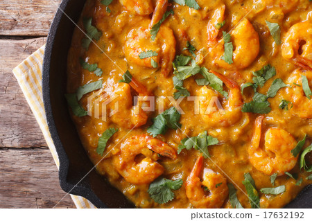 Prawns in curry sauce close-up view from above 17632192