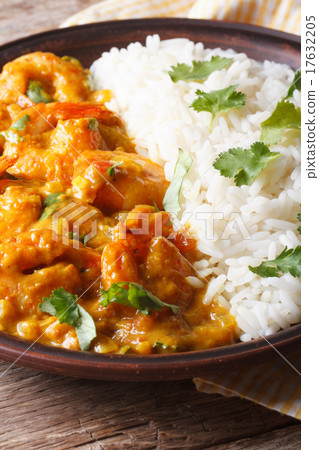 Shrimps in curry sauce with rice and cilantro  17632205