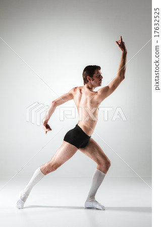 The young attractive modern ballet dancer on white background The young attractive modern ballet dancer on white background 17632525