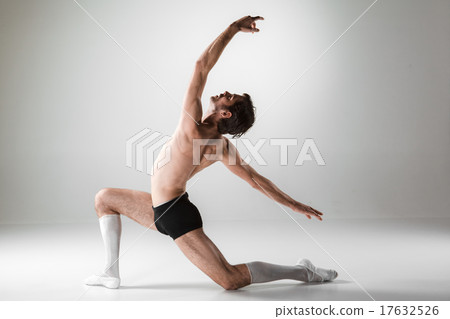 The young attractive modern ballet dancer on white background The young attractive modern ballet dancer on white background 17632526
