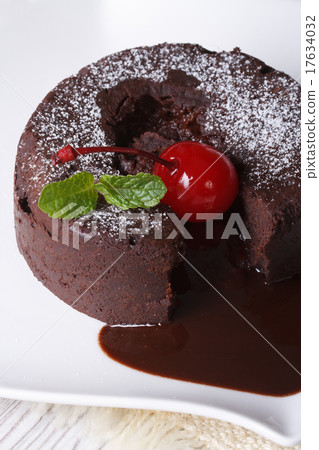 chocolate fondant with cherries and mint closeup 17634032
