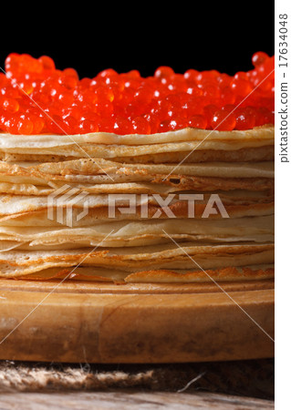 crepes with red caviar macro isolated on black 17634048