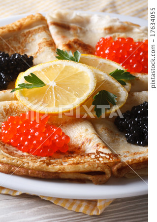 Stock Photo: Crepes with red and black caviar close-up vertical