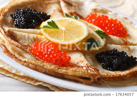Thin crepes with red and black caviar macro  17634057