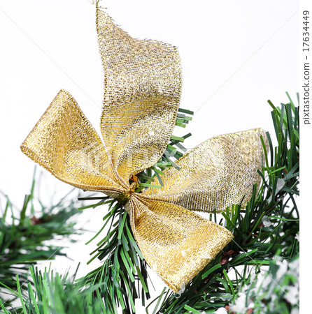 Decoration golden billow on new year tree branch Decoration golden billow on new year tree branch 17634449
