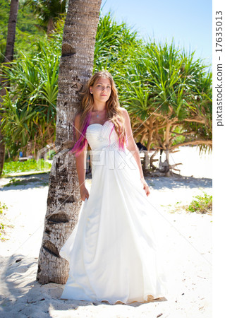 Tropical wedding, bride near palm tree Tropical wedding, bride near palm tree 17635013