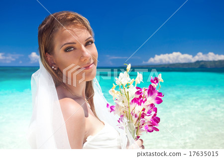 Beautiful bride on tropical beach 17635015