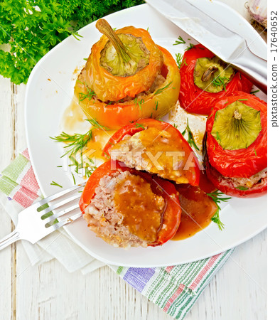 Pepper stuffed meat and rice with sauce in plate Pepper stuffed meat and rice with sauce in plate 17640652