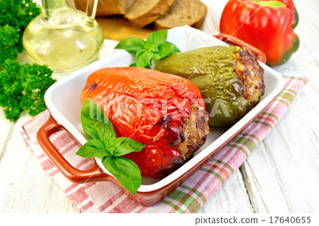 Pepper stuffed meat in brown roaster with basil Pepper stuffed meat in brown roaster with basil 17640655