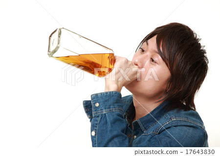 A man drinking a trumpet 17643830