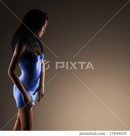 Sexy brunette woman posing in dark studio Sexy brunette woman posing in dark studio 17644635