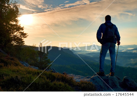 Silhouette of man with backpack. Sunny day in rock Silhouette of man with backpack. Sunny day in rock 17645544