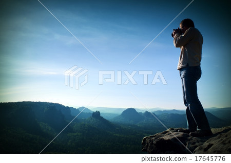 Professional photographer takes photos in rocks Professional photographer takes photos in rocks 17645776