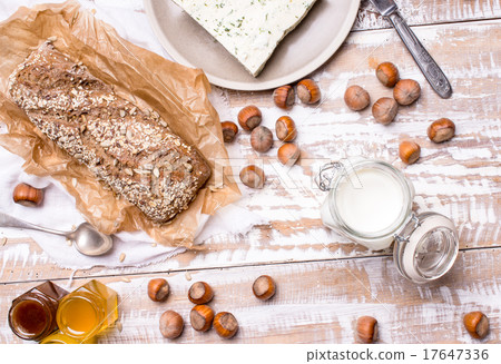 Bread with seeds and cheese for breakfast 17647336