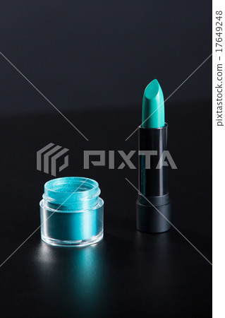 Lipstick and eye shadow in bright teal green color 17649248