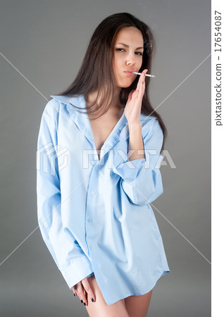 Young pretty brunette woman with cigarette 17654087