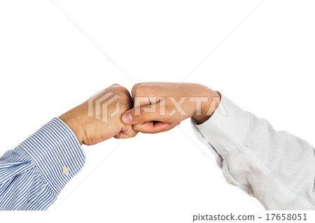 Fist bump on formal wear, gesturing an agreement Fist bump on formal wear, gesturing an agreement 17658051