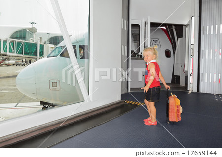 Baby walks for boarding to flight in airport gate Baby walks for boarding to flight in airport gate 17659144