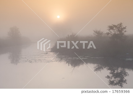 A beautiful foggy sunrise 17659366