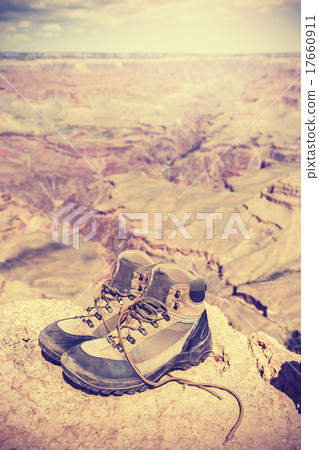 Vintage toned old trekking shoes in Grand Canyon.. 17660911