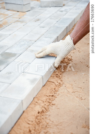 Installation of brick platform - bricks on sand 17663690