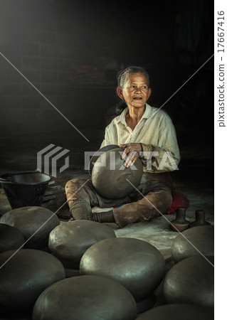 Potter  making clay pot. 17667416
