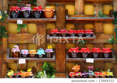 Colorful jam jars arranged for sale 17669152