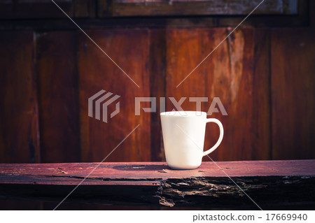 Hammer on wooden bench and wooden background 17669940