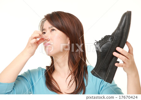 A woman who is afraid of the stench of leather shoes A woman who is afraid of the stench of leather shoes 17670424