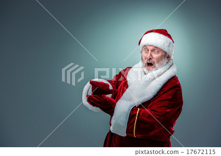 Santa Claus, presenting something. Santa Claus, presenting something. 17672115