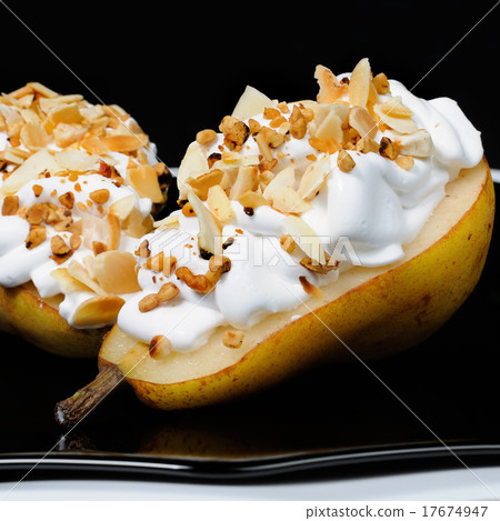 Pear with whipped cream and nuts 17674947