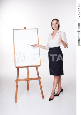 young business woman showing something on the young business woman showing something on the 17675349