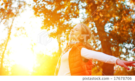 Stock Photo: happy girl enjoying life and freedom in autumn on nature