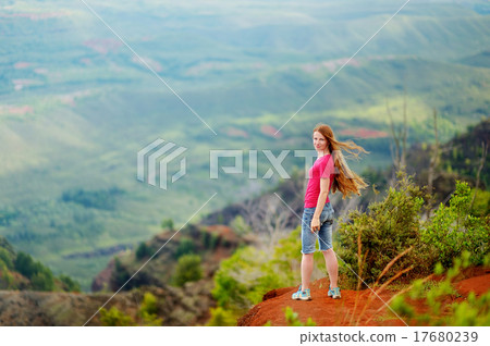 Woman enjoying stunning view into Waimea Canyon Woman enjoying stunning view into Waimea Canyon 17680239